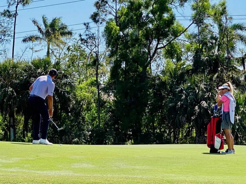 Steve Stricker 2023 Chubb Classic in Naples, Florida.  Putting on the green with his wife as a caddy. 