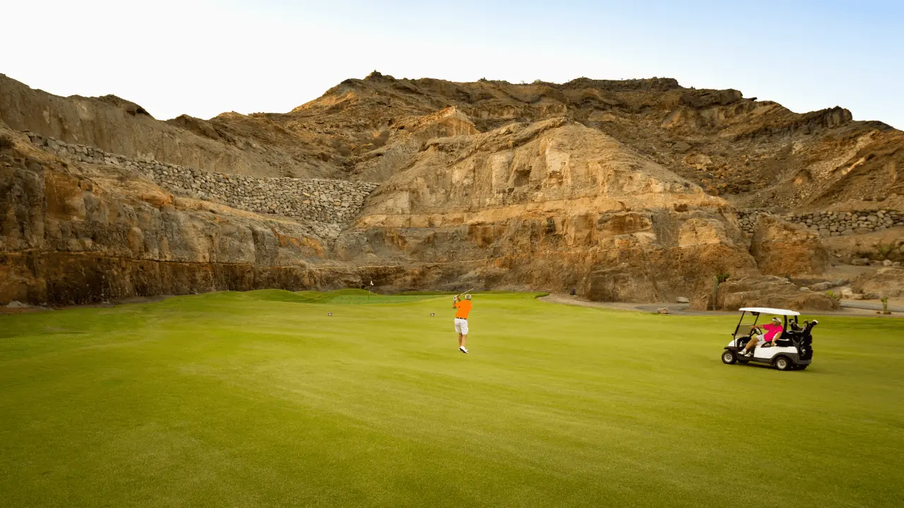 golfers on the fairway on a beautiful golf course in a canyon