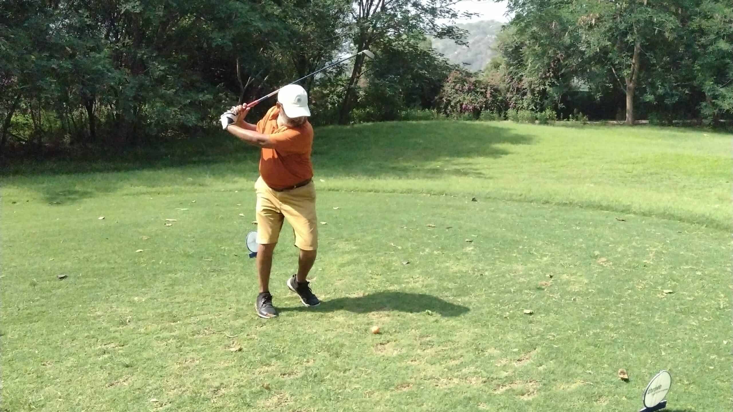 Ankur hitting his Mizuno golf club off the tee box