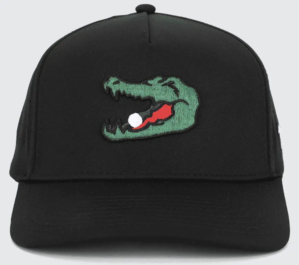 Waggle Golf one of the best unknown golf club brands for unusal hats.  Showing an alligator with ball in its mouth on a black hat.
