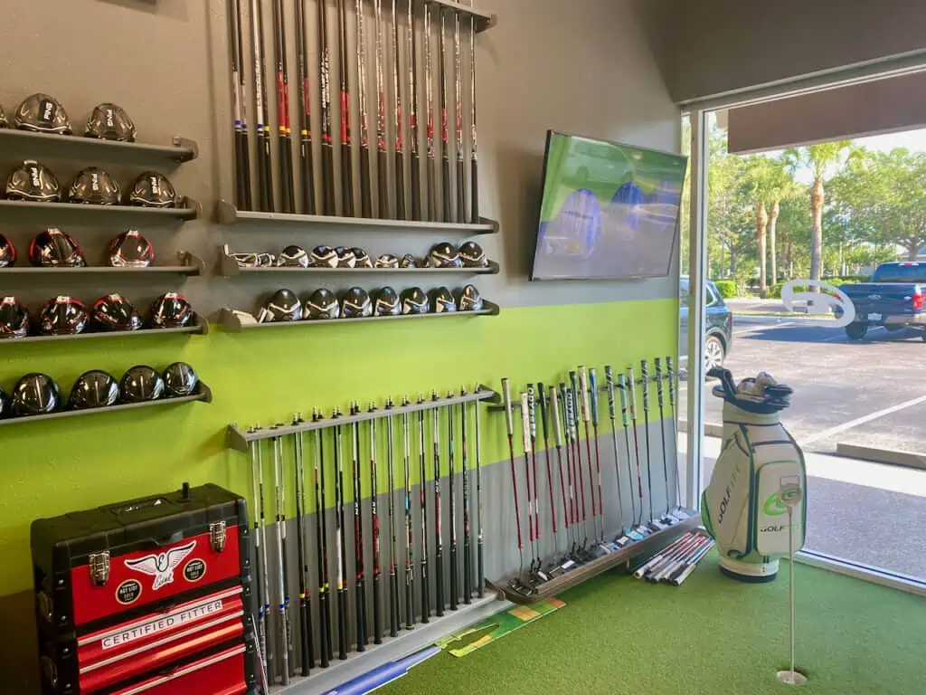 GolfTEC fitting showing multiple clubheads and shafts 