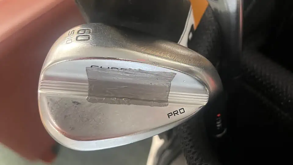 lead tape on wedges showing lead tape on an iron belonging to pro golfer
