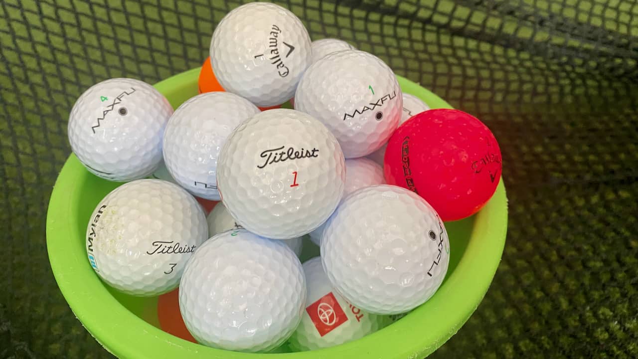 Bucket of golf balls with Pro V1 golf balls and Pro V1 Alternatives