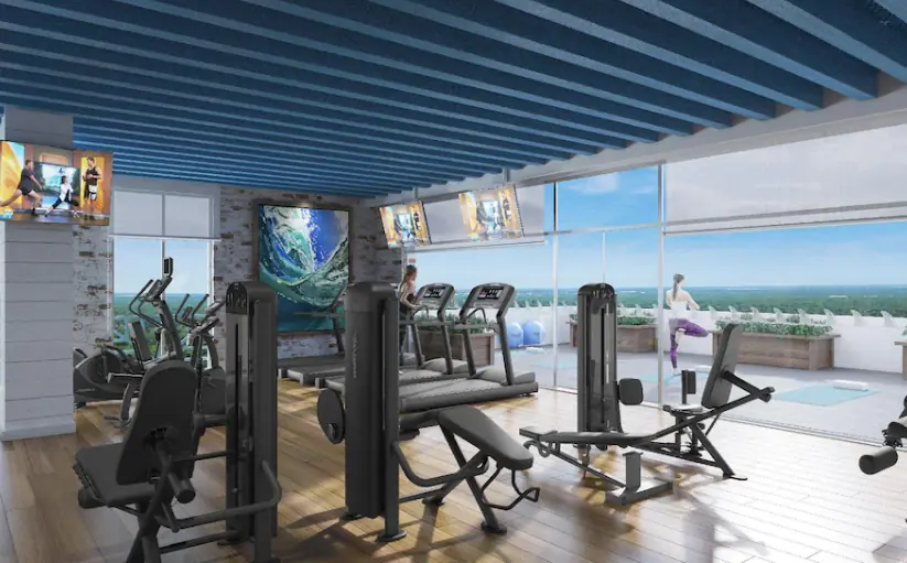 Margaritaville Beach Resort Riviera Cancún by Agoda showing the water and white sand beach in the background of the fitness gym on property