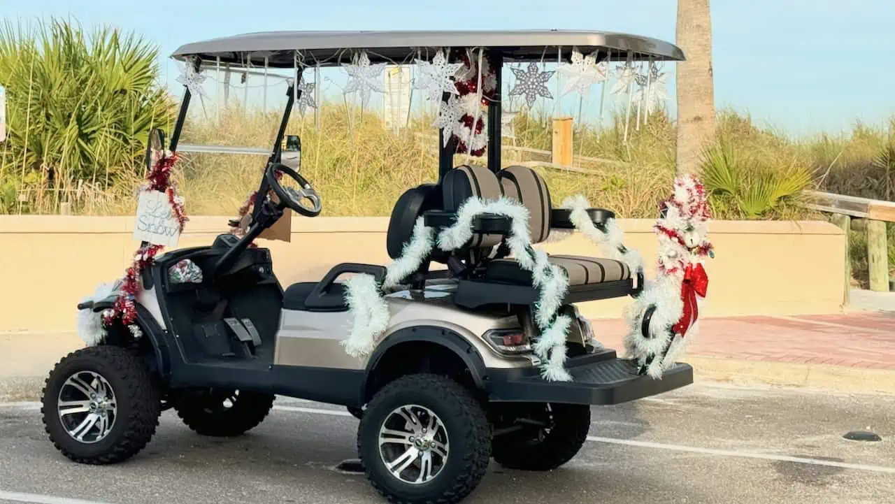 golf cart photo fully decorated in Christmas decorations in Florida.