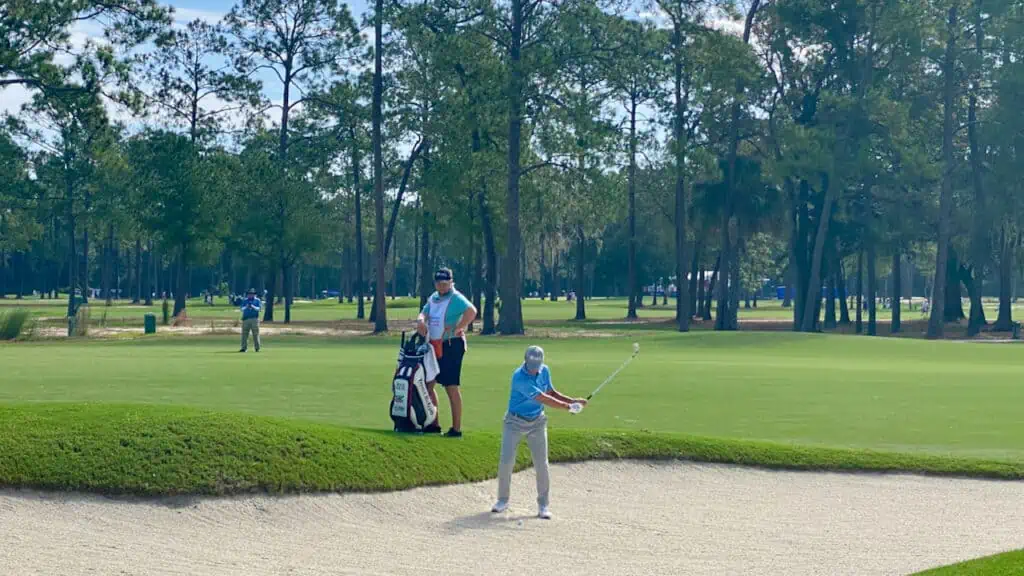 Mike Weir hitting out of a bunker in 2023.