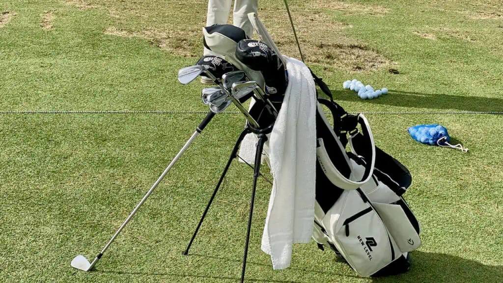 Showing golf clubs of senior golfer displaying his iron