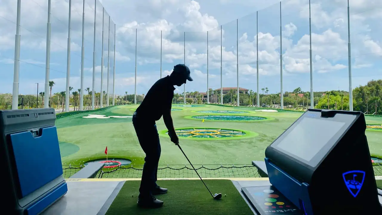 Top Golf Review: Showing Senior Golf Source team member hitting on the course.
