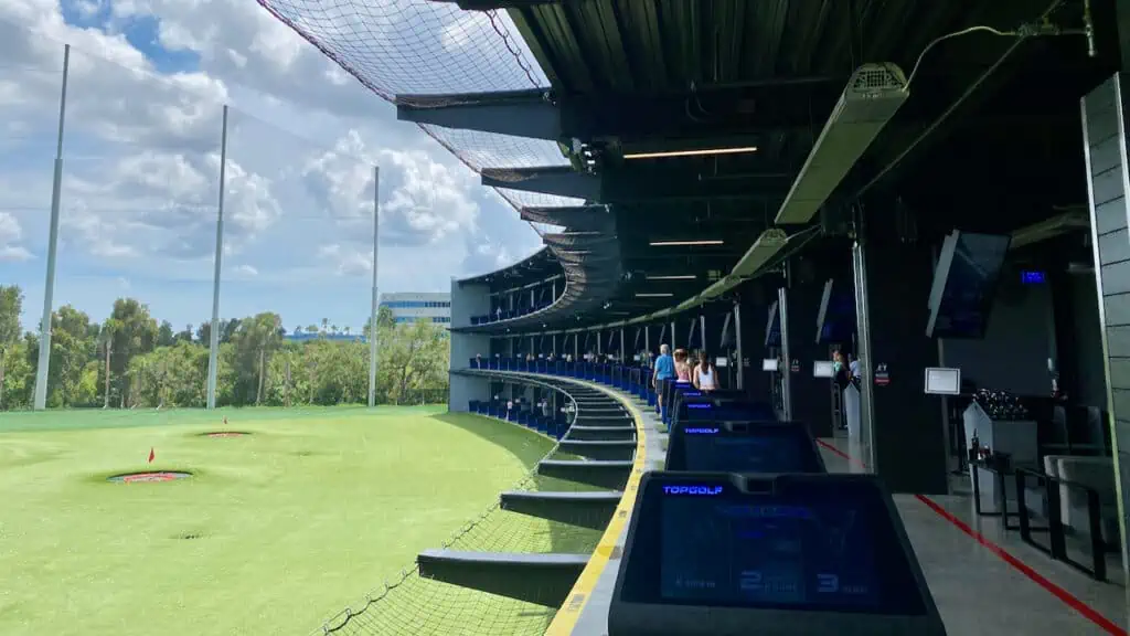 How to practice golf in the winter?TopGolf is shown as one option with covered hitting bays 