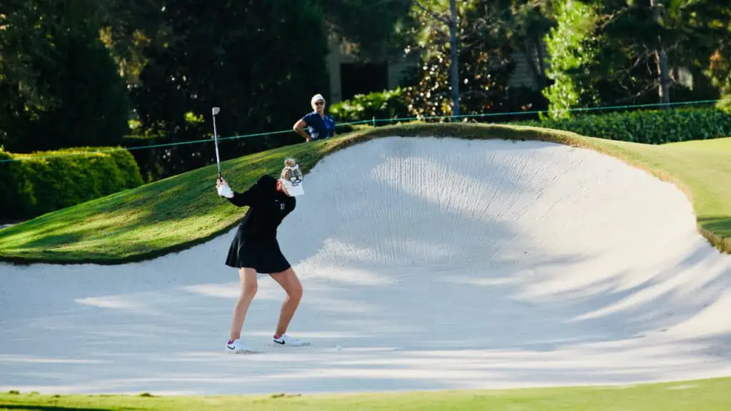 Nelly Korda shown at the bunker hitting her wedge at the Pelican Golf Club 