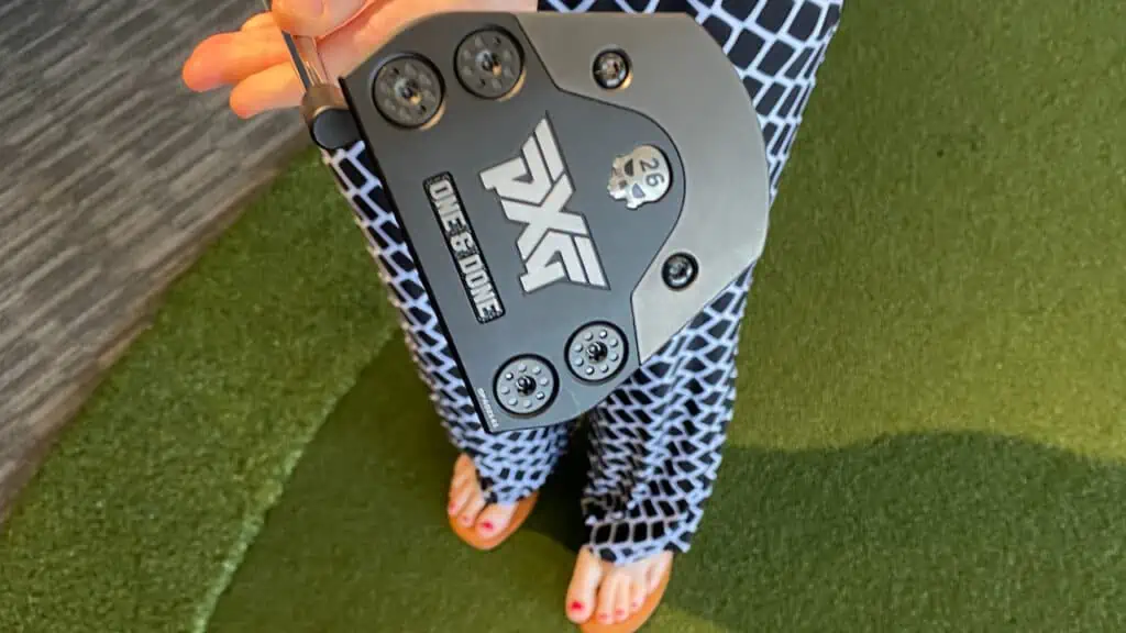 Erin with senior Golf source holding the PXG putter.