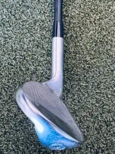 It shows wider soles on a golf wedge, which zooms in on the thick bottom of the clubhead.