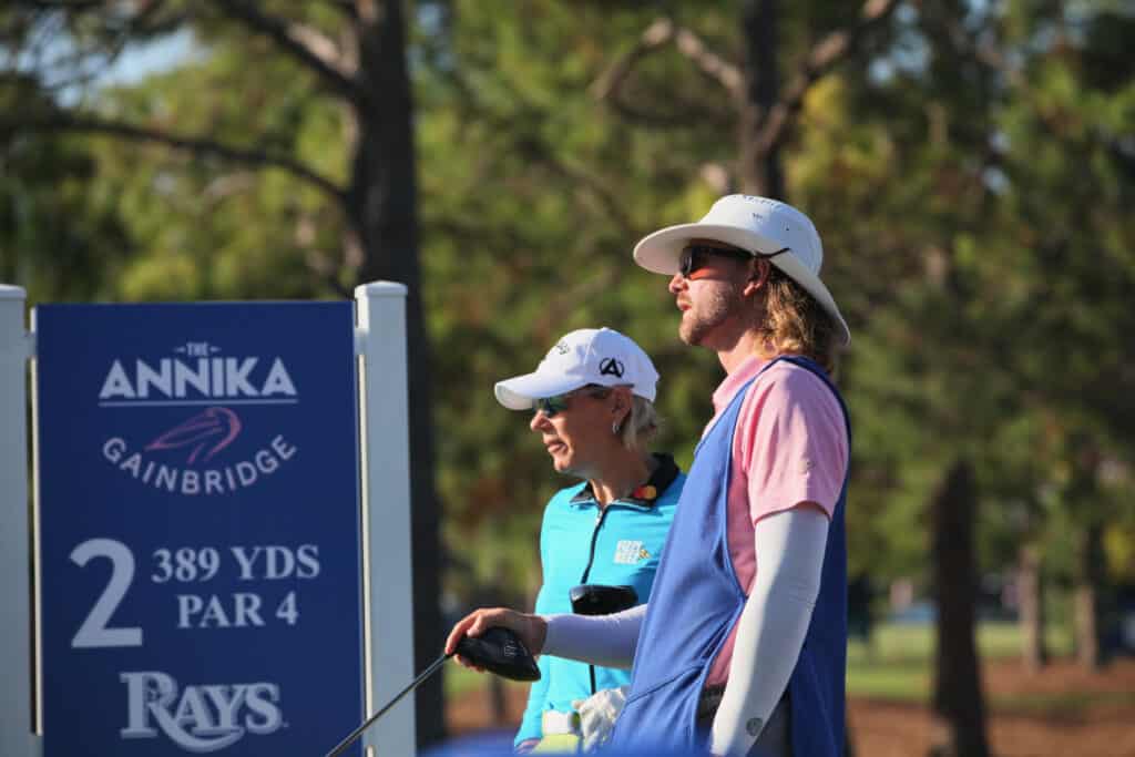 Cortland Schofield caddie providing golf course management tips of the Pelican Golf Club to Annika Sorenstam.