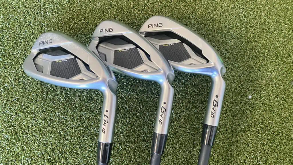 Senior Golf Source testing the Ping  G430 irons, showing 3 laying on the golf simulator green.