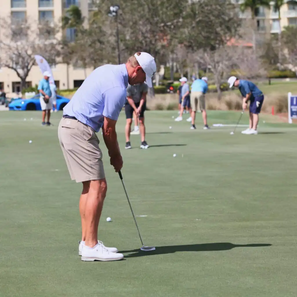 Odyssey White Hot 2 putter and Steve Stricker on the practice putting green in 2024. Taken by Senior Golf Source.