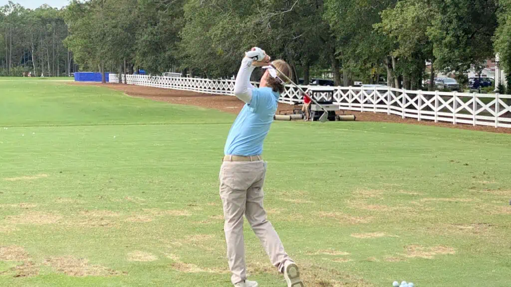 Brett Quigley practicing at the driving range.