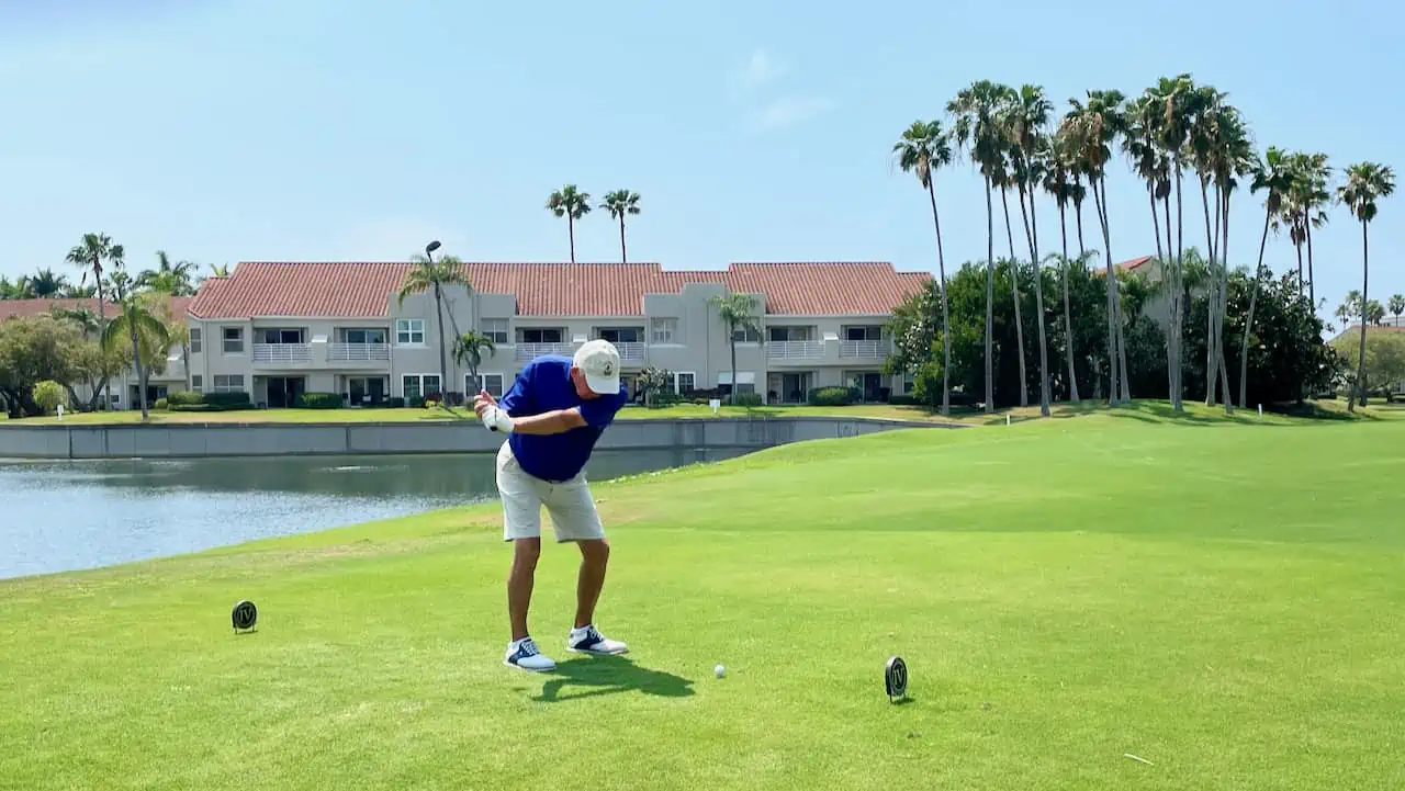 senior golfer hitting from the senior tees on a course in Florida