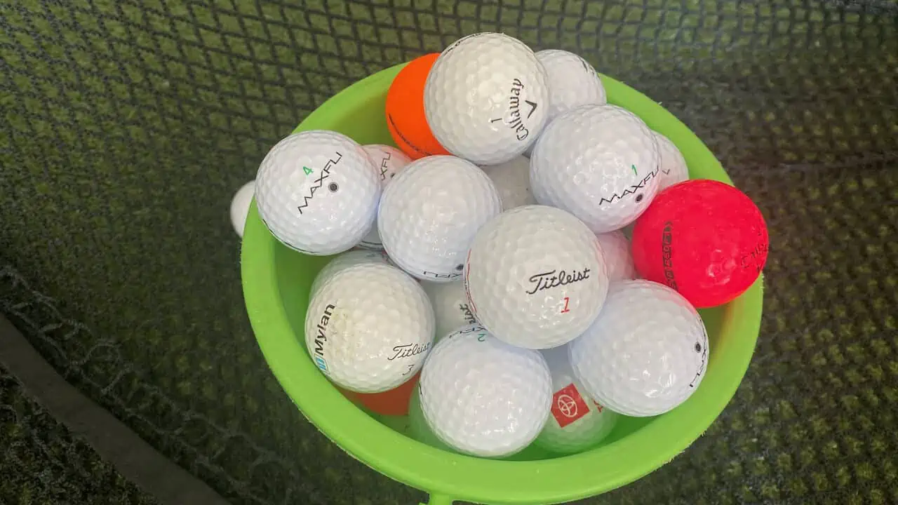 Showing some of the straightest golf balls on the market in a bucket.