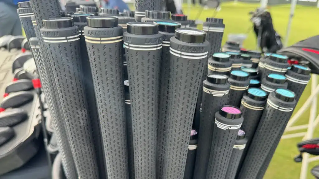 golf grips are shown in a pile of varying types