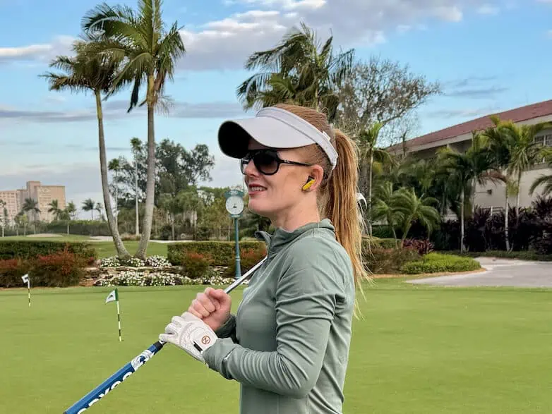 Glove It Golf Visor with Erin on the putting green