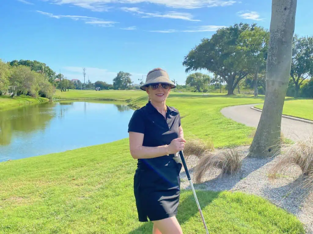 Lady Hagen Golf Sun Visor with Erin wearing it on a golf course