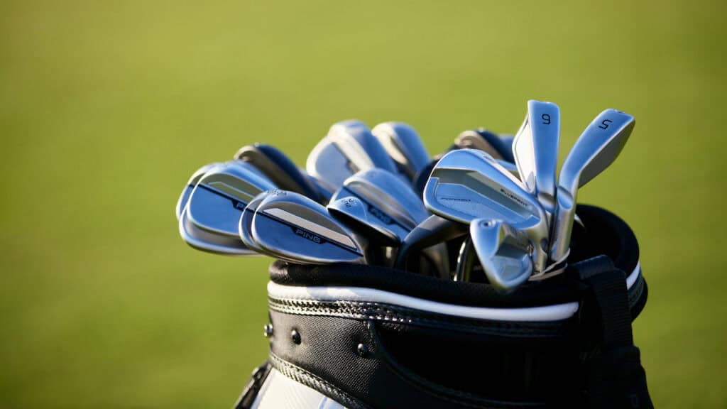 Showing a set of golf irons in a golf bag
